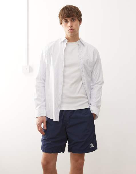 adidas Originals Trefoil essentials woven shorts in blue and white
