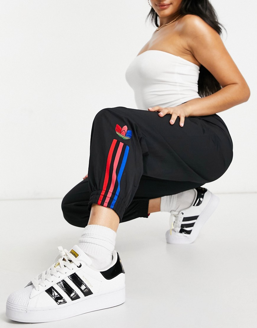 Adidas Originals trefoil three stripe track pants in black