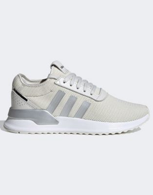 white and silver adidas trainers