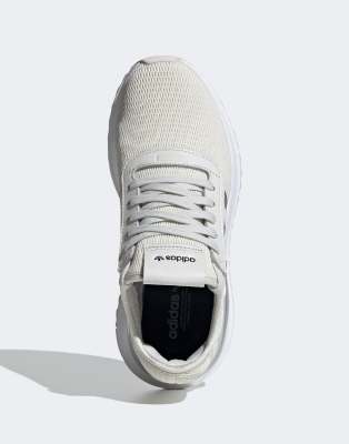 white and silver adidas trainers