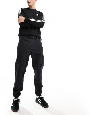 Adidas rubberised utility store pants