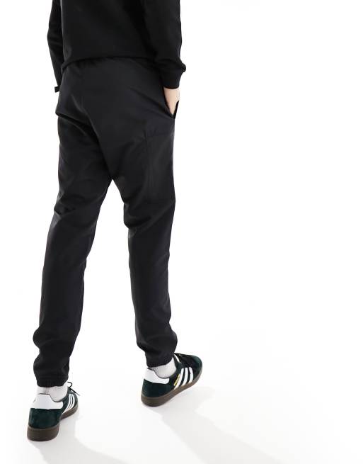 Adidas rubberised utility store pants