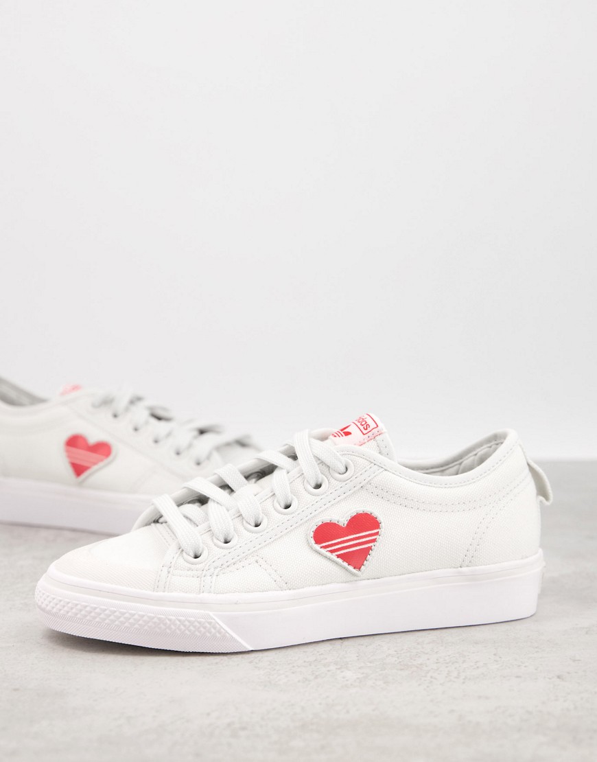 Adidas Originals Valentines Nizza trainers in white with heart print