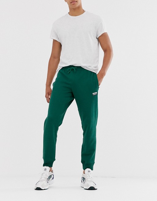 adidas Originals vocal joggers with logo print in green