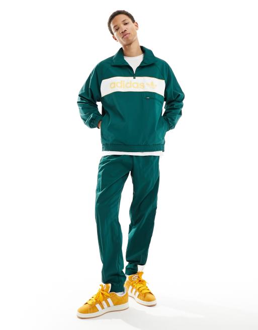 adidas Originals Windjacke in Dunkelgrun und Gelb mit linearem Logo ASOS