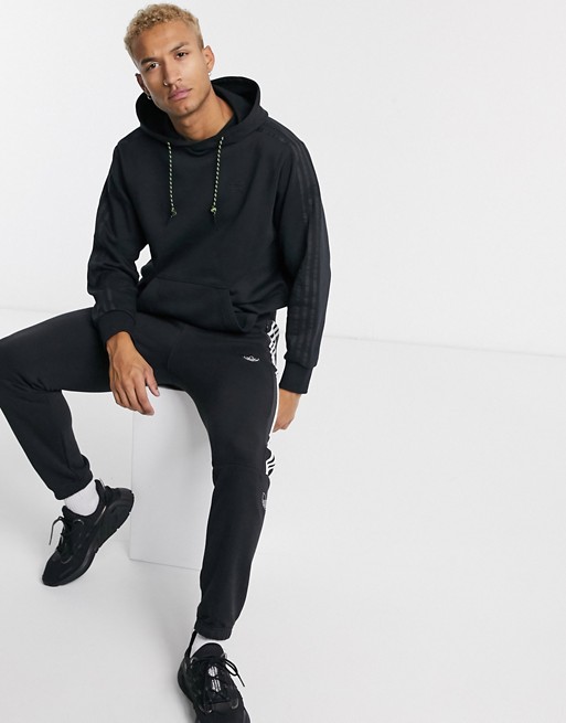 adidas originals winterized hoodie in black with 3 stripes tech pack