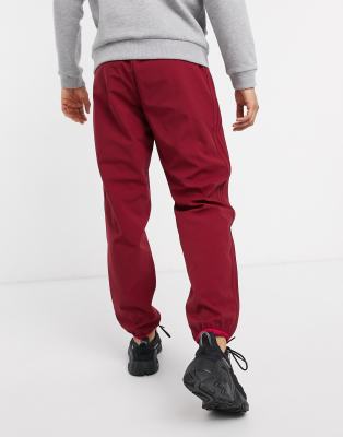 adidas originals three stripe track pants in burgundy