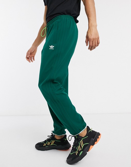 adidas Originals winterized joggers with 3 stripes in green tech pack