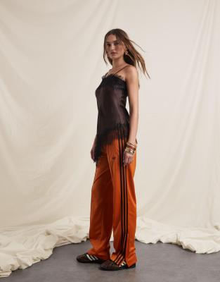 adidas Originals adidas Originals x ASOS Firebird track pants in orange and brown