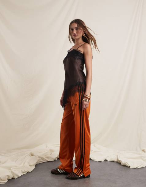 adidas Originals x ASOS Firebird track pants in orange and brown - view 1