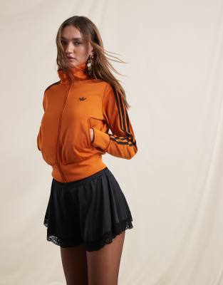 adidas Originals adidas Originals x ASOS Firebird track top in orange and brown