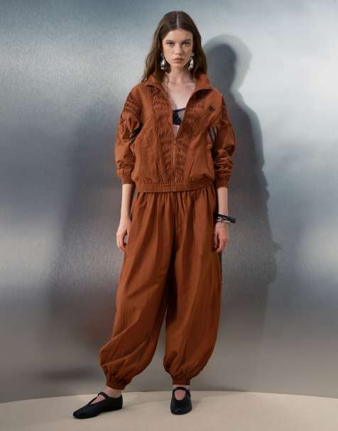 adidas Originals x ASOS track jacket with pleated panels and balloon joggers in rust - view 1