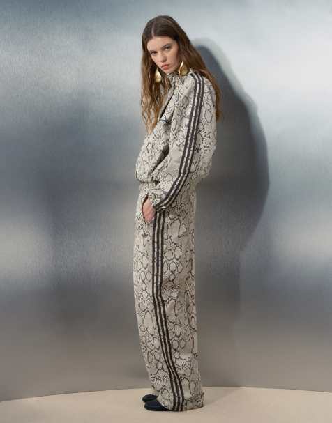 adidas Originals x ASOS wide leg track pants in beige snake print - view 1