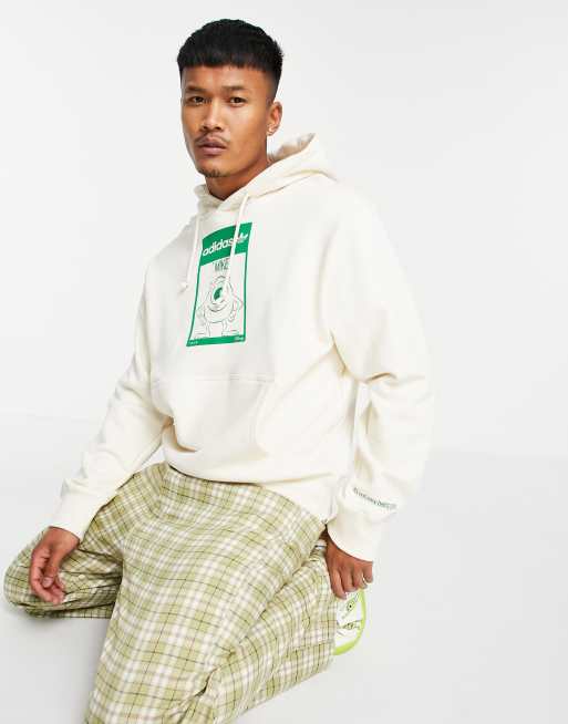 adidas Originals x Disney – Unisex – Kapuzenpullover mit Mike-Wazowski-Print in gebrochenem Weiß