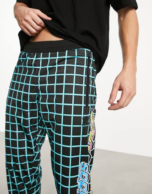 adidas Originals x Jeremy Scott Rally track pants in black