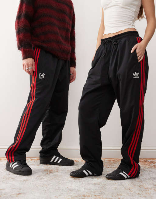 adidas Originals x KoRn reversible track bottoms in black, red and