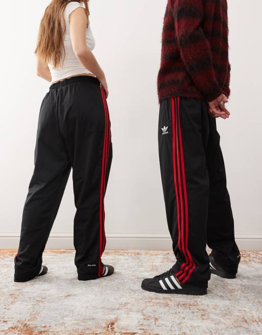 adidas Originals x KoRn reversible track bottoms in black, red and