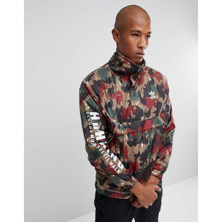 adidas Originals x Pharrell Williams Hu Hiking Half Zip Windbreaker In Camo  Print CY7871