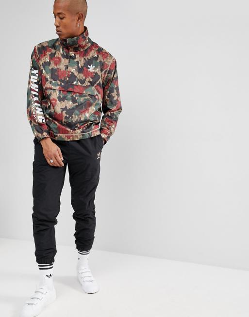 adidas Originals x Pharrell Williams Hu Hiking Half Zip Windbreaker In Camo Print CY7871 adidas Originals x Pharrell Williams Hu Hiking Half Zip Windbreaker In Camo Print CY7871