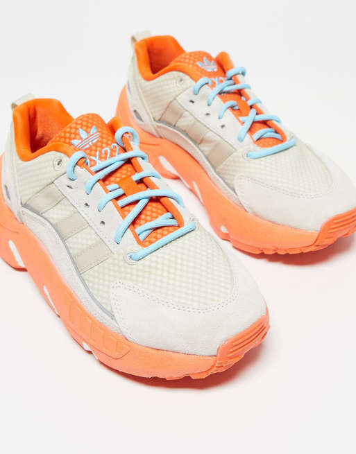 adidas Originals – ZX 22 Boost – Buty sportowe w kolorze złamanej bieli z pomarańczowymi detalami