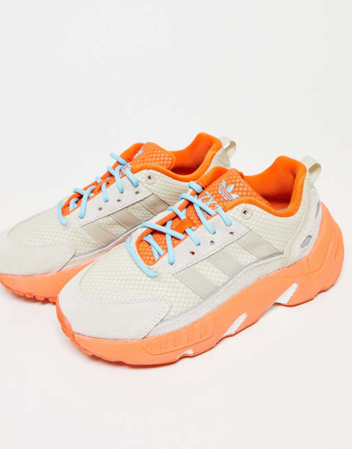 adidas Originals ZX 22 Boost trainers in off white with orange detail