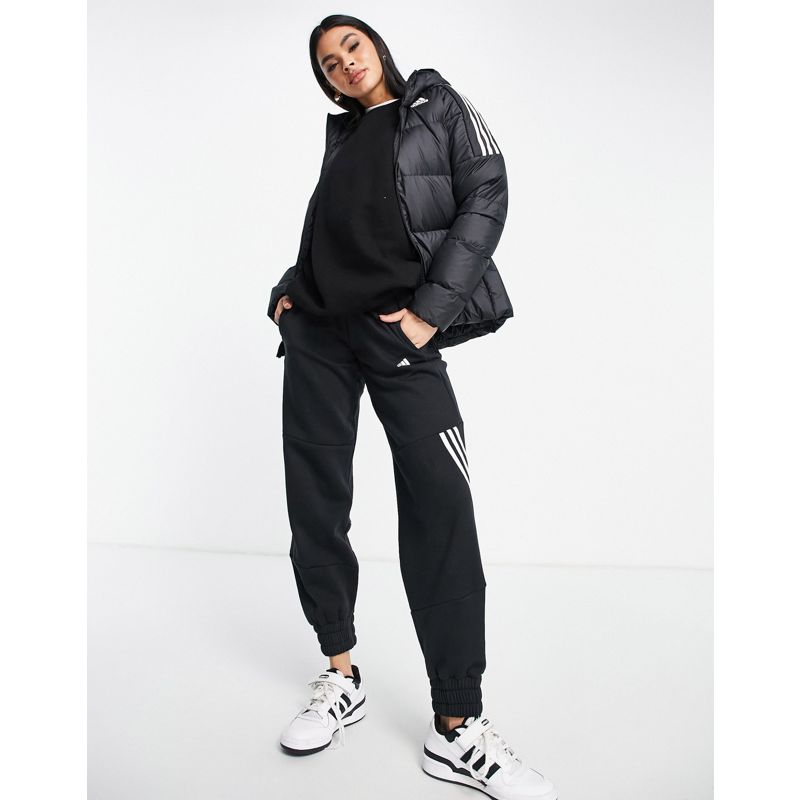 Donna Cappotti e Giacche adidas - Outdoor - Piumino con cappuccio nero con 3 strisce