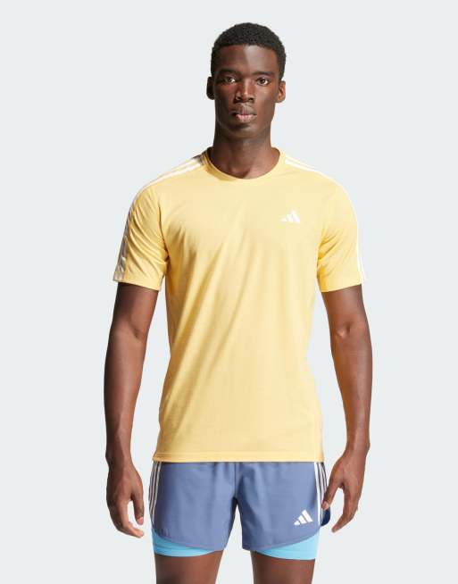 adidas – Own the Run – T-Shirt in Orange mit den 3 Streifen