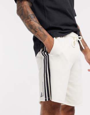 pantaloni adidas strisce bianche