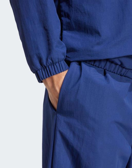 adidas performance Essential small logo woven open hem pant in dark blue / white, 4 of 4