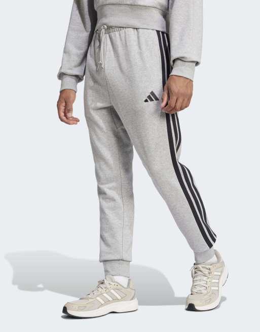 adidas performance – Essential – Spodnie z tkaniny french terry w szarym melanżowym kolorze z 3 czarnymi paskami