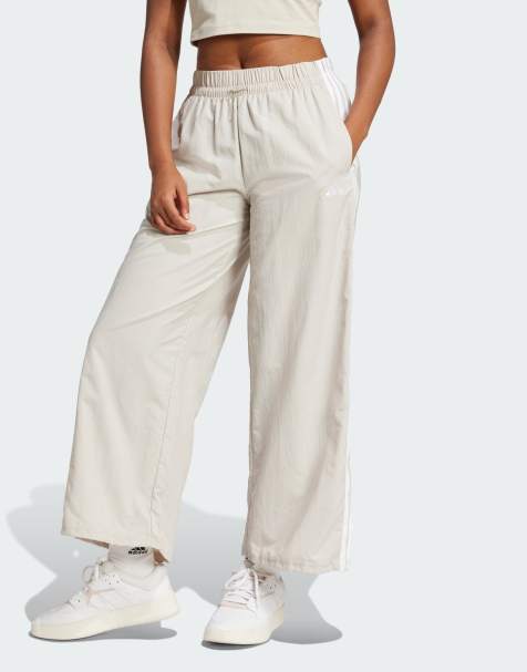 adidas performance Essentials 3-stripes lifestyle woven parachute pants in beige and white - view 1