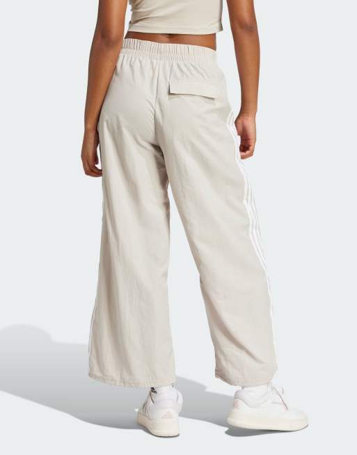 adidas Performance Essentials 3-stripes lifestyle woven parachute pants in beige and white, 2 of 4