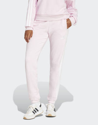 adidas performance - Essentials - Hose aus French Terry in klarem Rosa / Weiß mit den drei Streifen und Bündchen