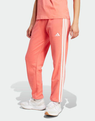 adidas Performance - Essentials - Hose in Semi Turbo/Weiß aus French Terry mit Bündchen und den 3 Streifen-Rot