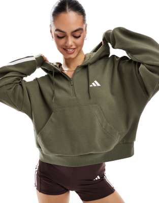 adidas Performance - Essentials - Kapuzenpullover aus French Terry in Grün mit kurzem Reißverschluss und den 3 Streifen