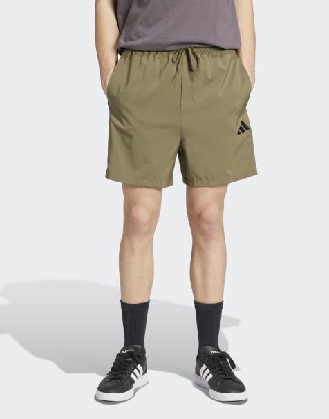 adidas performance - Essentials - Pantaloncini Chelsea verde oliva strata e neri con 3 strisce - view 1