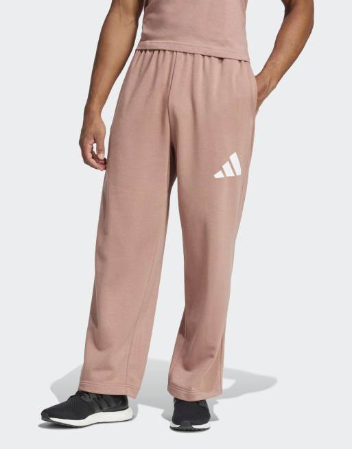 adidas performance - Essentials - Pantaloni con fondo ampio color argilla caldo con logo a 3 strisce bianco