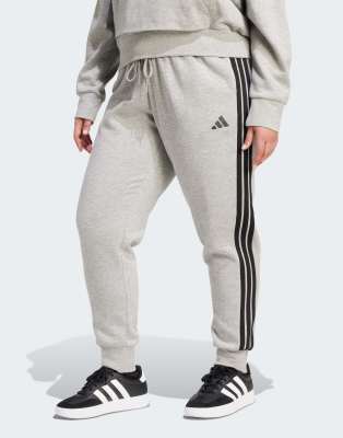 adidas Performance - Essentials - Schmal geschnittene Hose (Plus-Size) in mittlerem Heidegrau/Schwarz mit den 3 Streifen