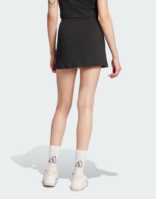 adidas Performance - Essentials - Skort aus Baumwolle in Schwarz mit Farbakzent