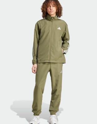 Performance - Gewebter Trainingsanzug in Olive Strata mit den drei Streifen-Grün Grün S