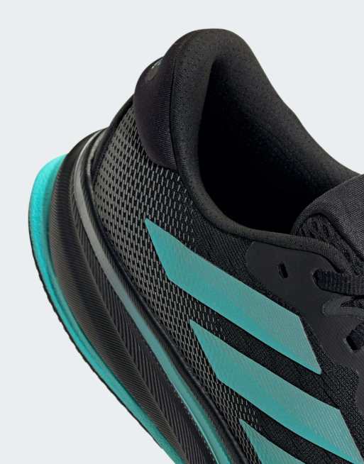 adidas Performance Mercedes AMG F1 Supernova rise 2 trainers in black and mint, 2 of 4
