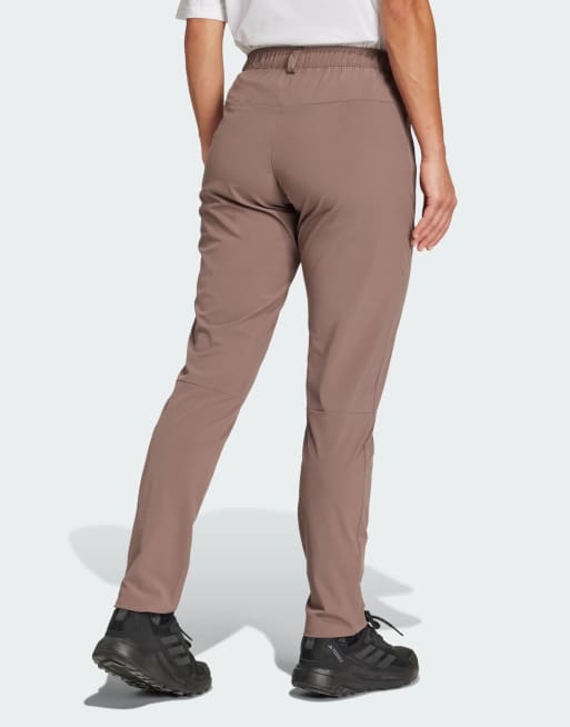 adidas performance Multi Essentials stretch pants in brown | ASOS