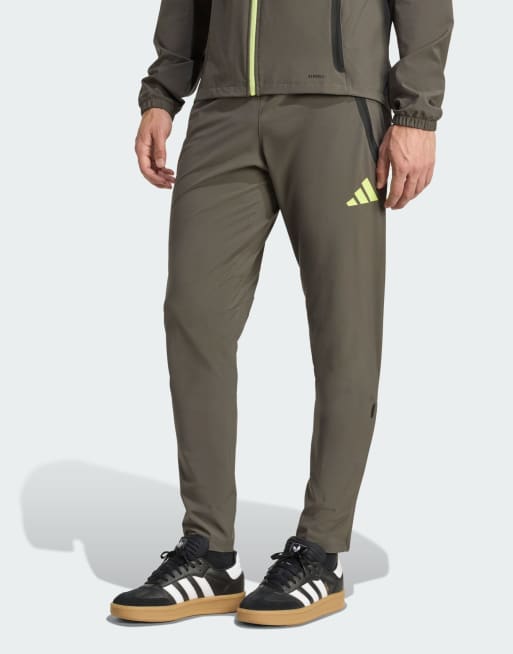 adidas performance Real madrid tiro 25 competition vis tech travel pants in utility grey / semi frozen yel