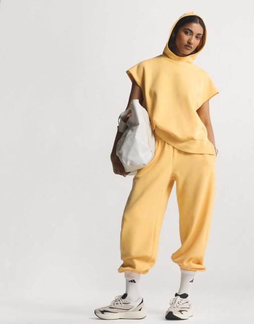 adidas performance - Soft Lux - Pantaloni ampi color mandarino semi ghiaccio