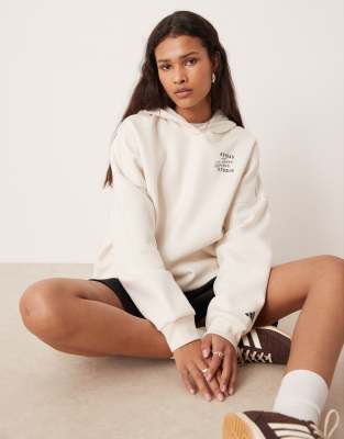 adidas Performance - Studios - Kapuzenpullover in Grau mit den drei Streifen