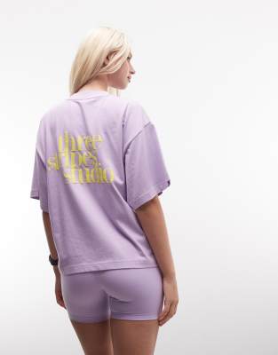 Performance - Studios - T-Shirt in Lila mit den drei Streifen und Grafik Lila M