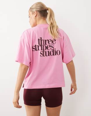 adidas Performance - Studios - T-Shirt in Rosa mit den drei Streifen