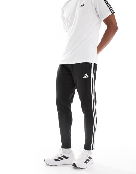 adidas Performance - Tiro 25 - Essentials - Winterbestendige trainingsbroek in zwart / wit - view 1