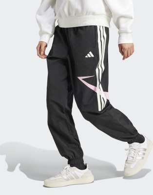 adidas Performance - Tiro Cut - Hosen in Schwarz / True Pink mit Color-Block-Design, den 3 Streifen und Bündchen