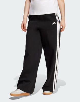 adidas Performance - Weite Fleece-Hose in Schwarz mit den 3 Streifen
